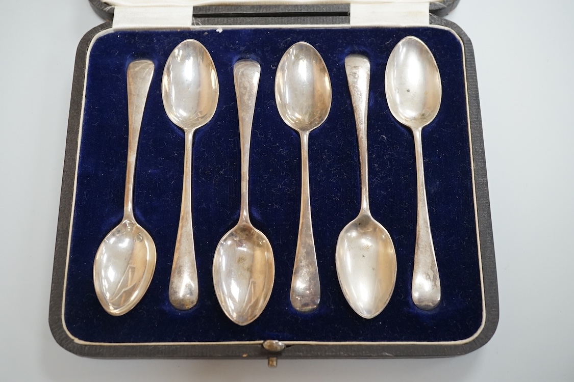 A cased set of six George VI silver teaspoons, James Dixon & Sons, Sheffield, 1948, a cased set of six silver and polychrome enamel coffee spoons and a cased single silver spoon.
